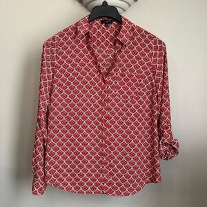 The limited roll tab sleeve blouse​